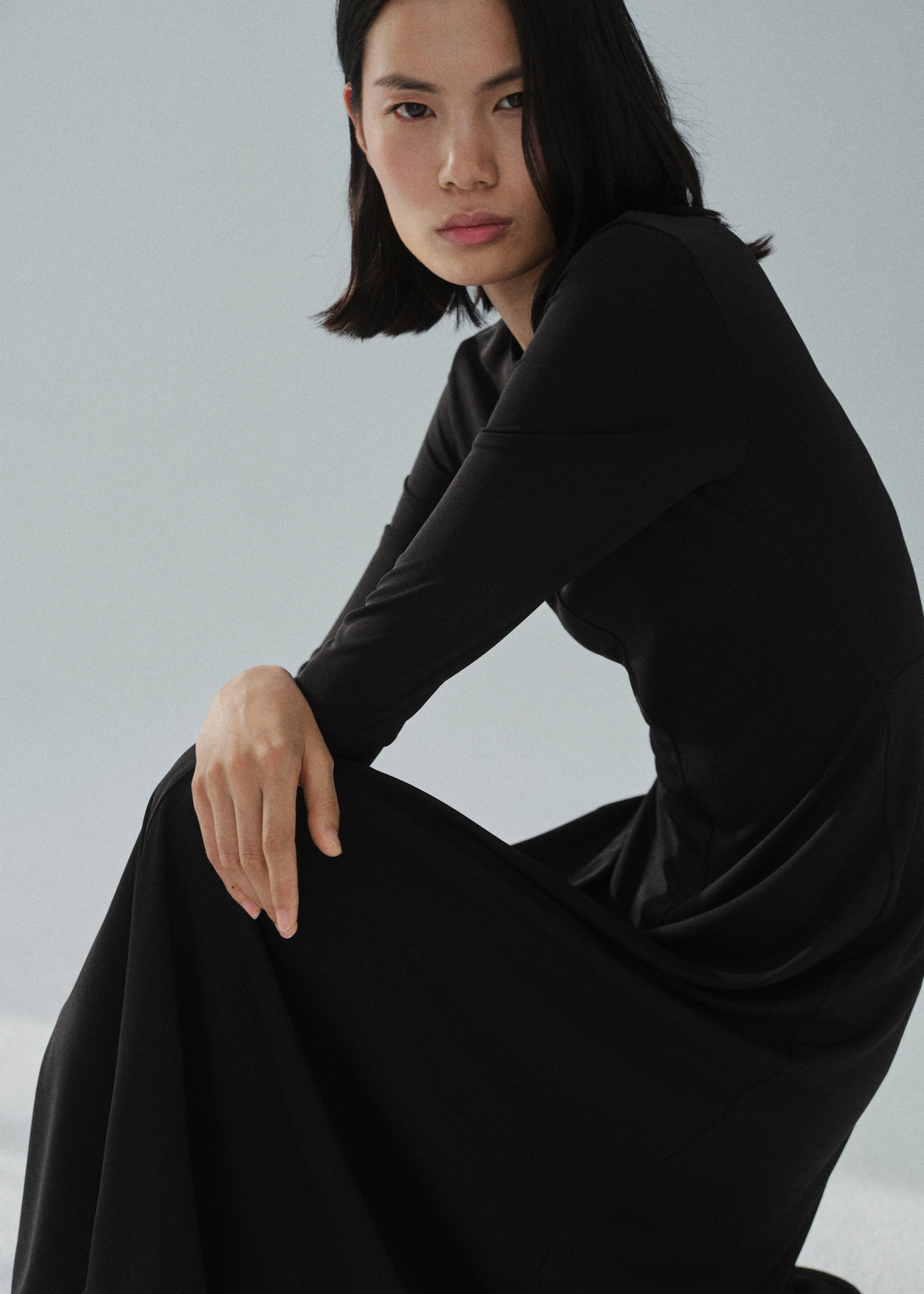 Long flared knitted dress - Details of the article 1, Black. Ref: 87094092-00.