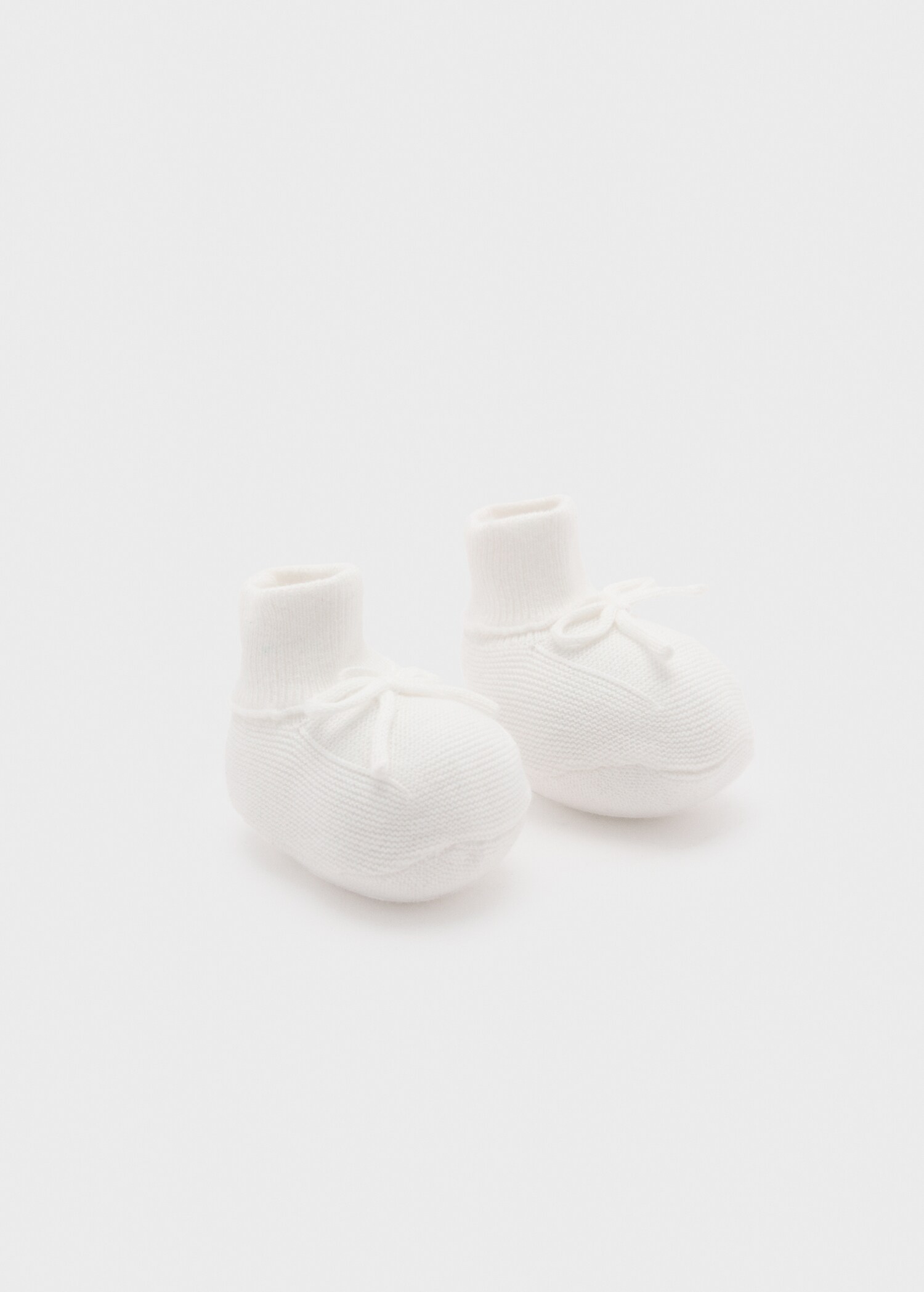 Knitted booties with bow - Reverse of the article